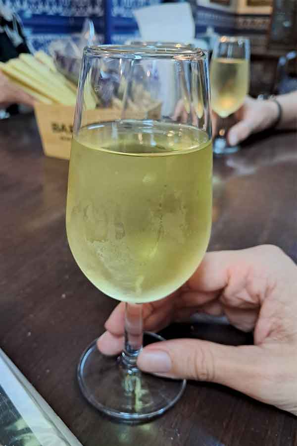 Glass of Manzanilla A glass of Manzanilla at Bar Bistec. A sherry glass filled with a light yellowish drink.