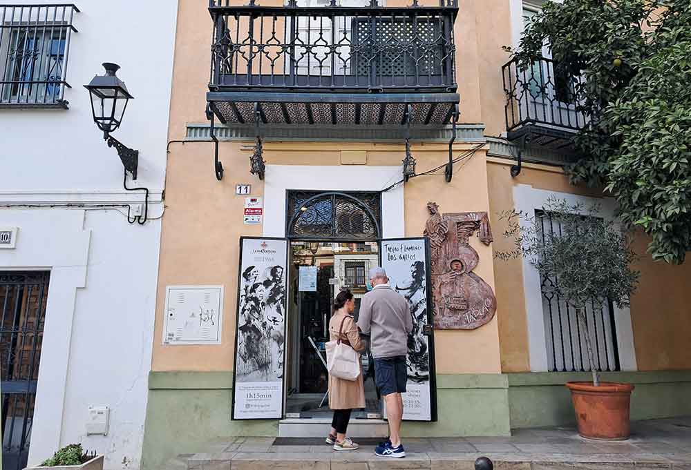 Tablao Los Gallos Outside Tablao Los Gallos in a traditional building in Barrio Santa Cruz. Two people outside the entrance.