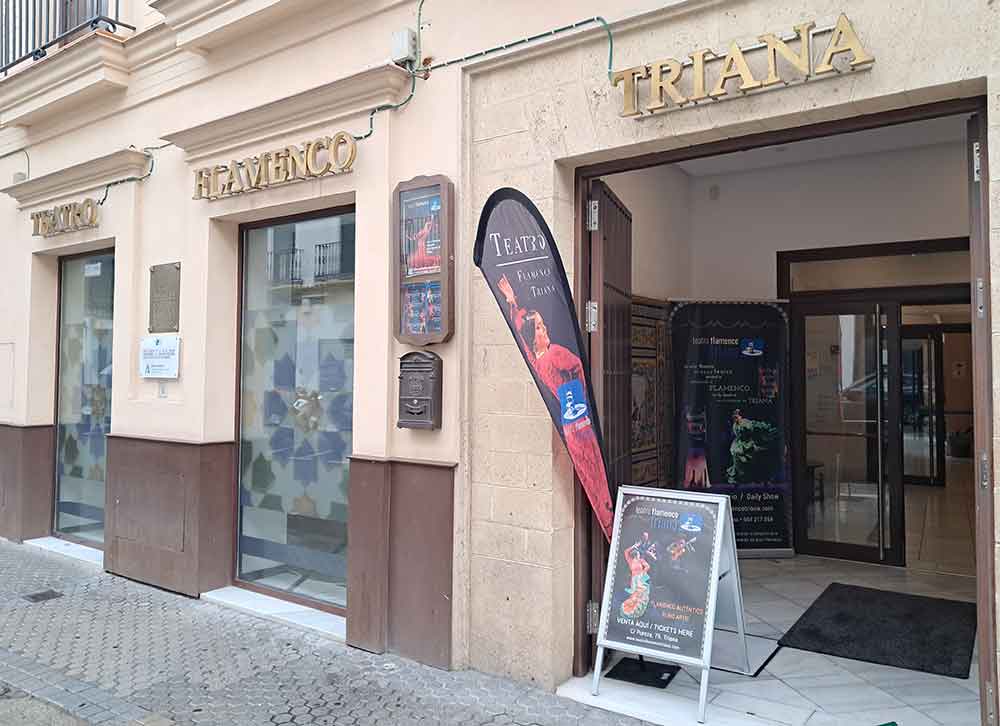 Teatro Flamenco de Triana Outside Teatro Flamenco de Triana with lettering in gold and anners outside the door.