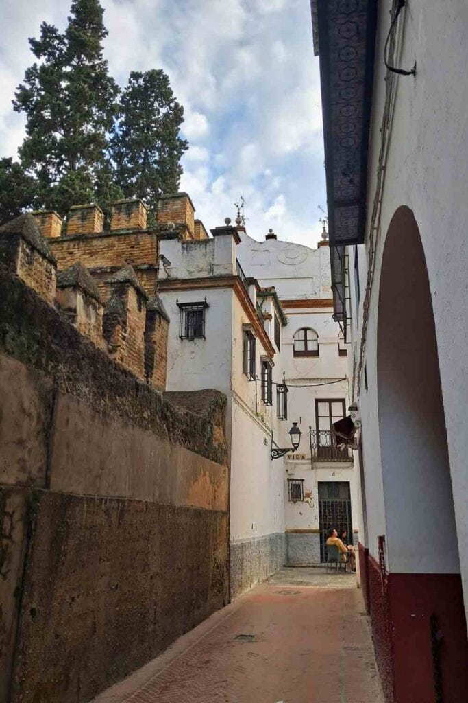Callejón del Agua in Barrio Santa Cruz, Seville, running beside the Alcázar walls in the old Jewish Quarter.