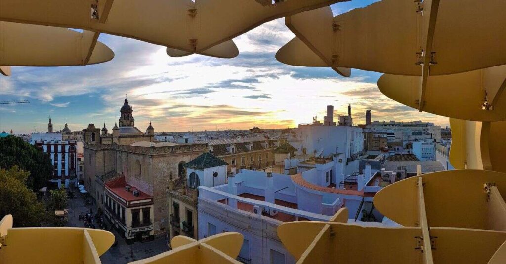 Seville old town looking through the lattice structure of La Setas during sunset in Seville.