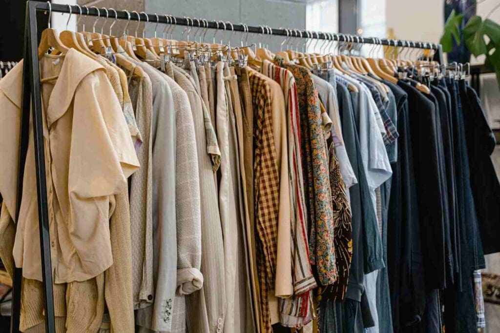 vintage shopping in seville with a rack of vintage clothing.